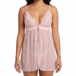 Woman wearing a pink lace nightgown on a white background