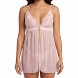Woman wearing a pink lace nightgown on a white background