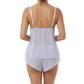 Woman wearing a light blue cami pajama set on a white background