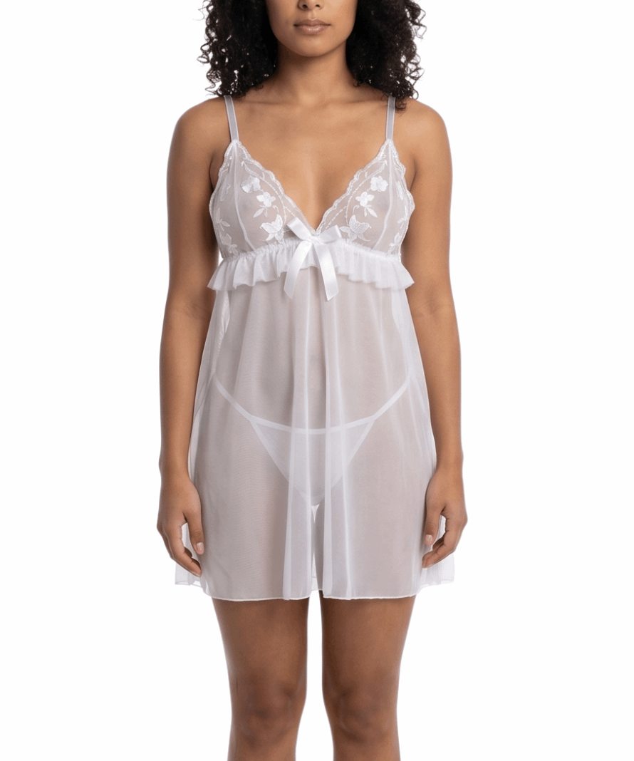 Woman wearing a white lace nightgown on a white background