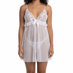Woman wearing a white lace nightgown on a white background