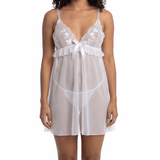 Woman wearing a white lace nightgown on a white background