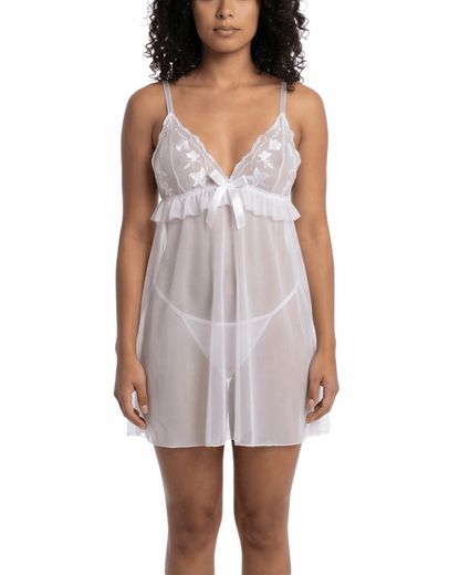 Woman wearing a white lace nightgown on a white background