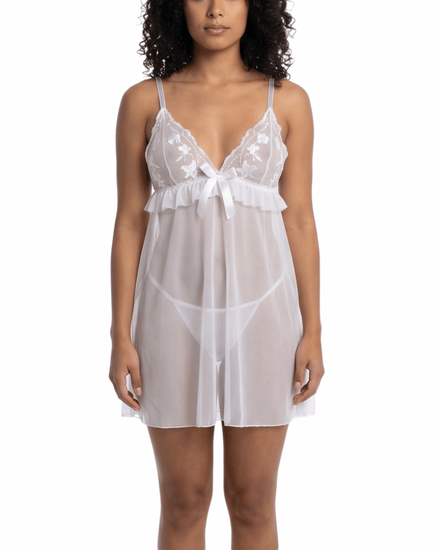 Woman wearing a white lace nightgown on a white background