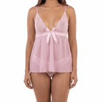 Woman wearing a pink lace nightgown on a white background
