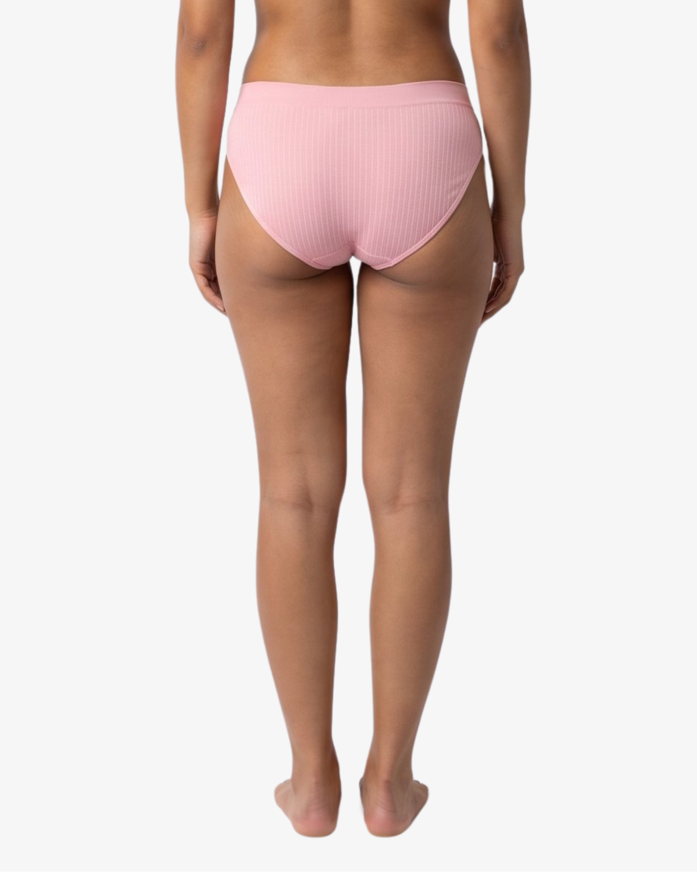 A woman modeling a light pink bikinis panty set against a plain light gray background.