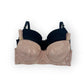 Black bra with floral lace trim on a white background