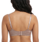 Woman wearing a beige bra on a white background