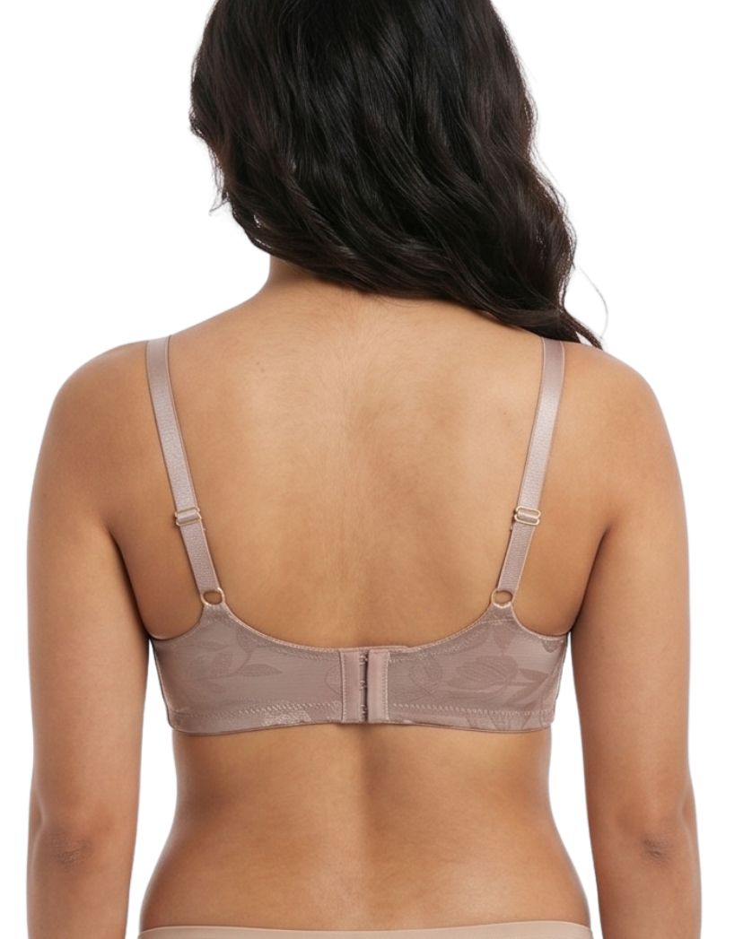 Woman wearing a beige bra on a white background