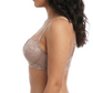 Woman wearing a beige bra on a white background