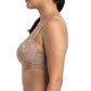 Woman wearing a beige lace bra and panties set on a white background