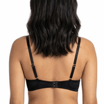 Woman wearing a black bra on a white background