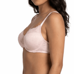 Woman wearing a light pink bra and panties set on a white background
