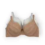 Nude bra with lace details on a white background