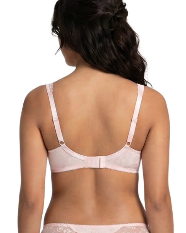 Woman wearing a light pink lingerie bra on a white background