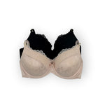 Beige bra and black bra on a white background