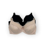 Beige bra and black bra on a white background