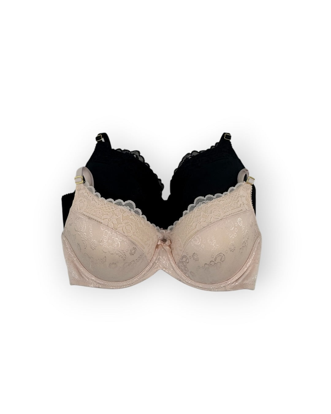 Beige bra and black bra on a white background