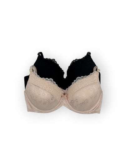 Beige bra and black bra on a white background