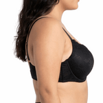Woman wearing a black lace bra on a white background