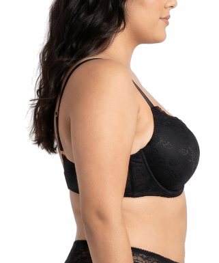 Woman wearing a black lace bra on a white background