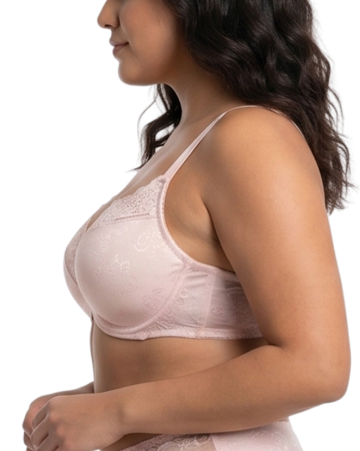 Woman wearing light pink comfort bra in a white background.