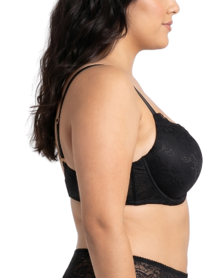 Woman wearing a black lace bra on a white background
