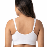 Woman wearing a white comfort bra on a white background