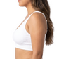 Woman wearing a white comfort bra on a white background