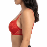 Woman wearing a red lace bra on a white background