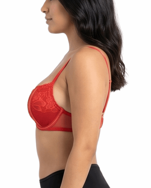Woman wearing a red lace bra on a white background
