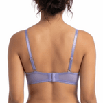 Person wearing a lavender lingerie set on a white background