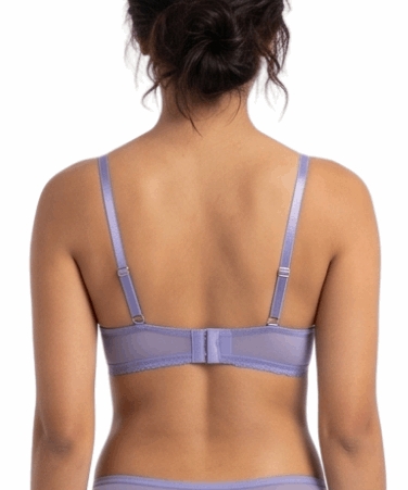 Person wearing a lavender lingerie set on a white background