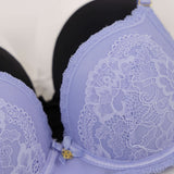 Light blue bra with lace details on a white background