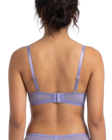 Person wearing a lavender lingerie set on a white background