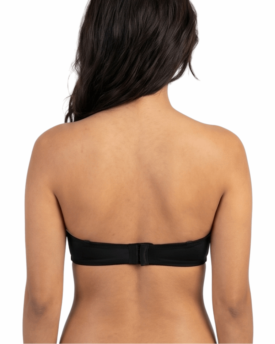 Woman wearing a black strapless bra on a white background