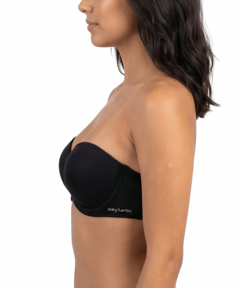Woman wearing a black strapless bra on a white background