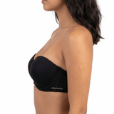 Woman wearing a black strapless bra on a white background
