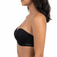 Woman wearing a black strapless bra on a white background