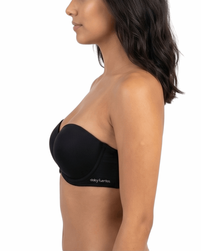 Woman wearing a black strapless bra on a white background