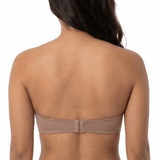 Woman wearing a mocha strapless bra on a white background