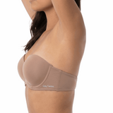 Woman wearing a mocha strapless bra on a white background