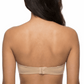 Woman wearing a nude strapless bra on a white background