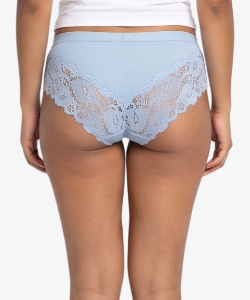 A woman modeling a light blue high-waisted briefs against a plain light gray background.