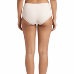 Woman wearing a beige panty on a white background