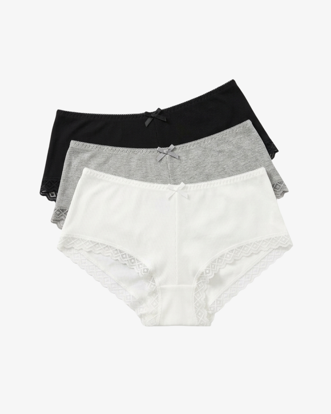 Three pairs of women's high-waisted briefs stacked together on a light gray background. The front pair is white with lace trim and a small bow at the center, the middle pair is heather gray, and the back pair is solid black.