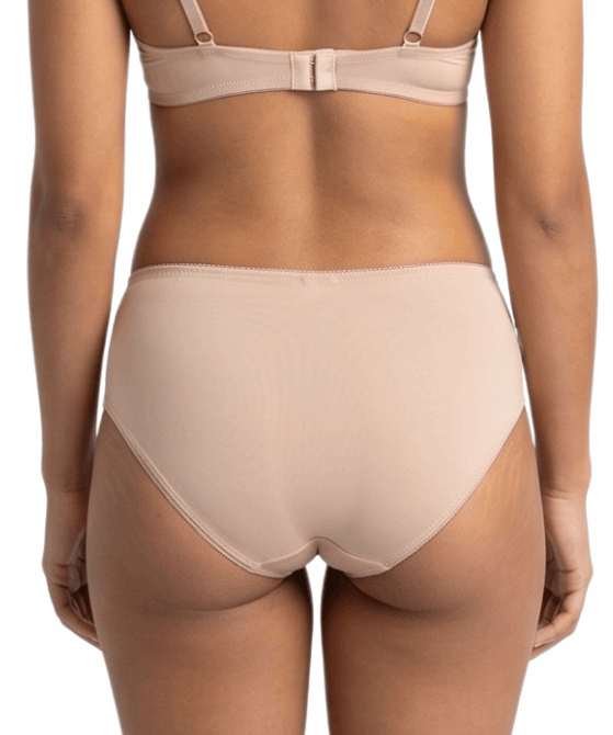 Beige lingerie set on a white background