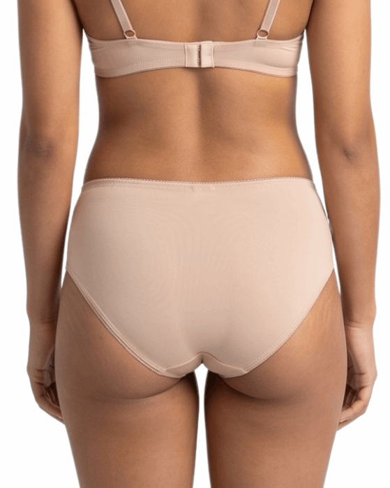 Beige lingerie set on a white background