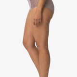 Side view of a model wearing high-waisted, light mauve-gray lace panties against a plain white background.