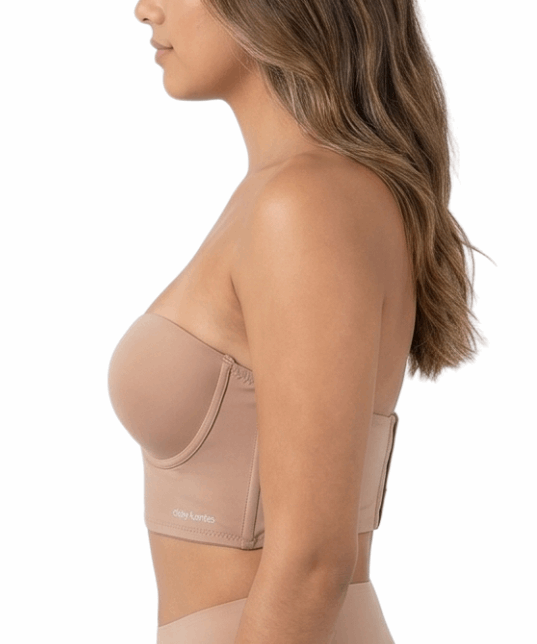 Woman wearing a beige longline bra on a white background
